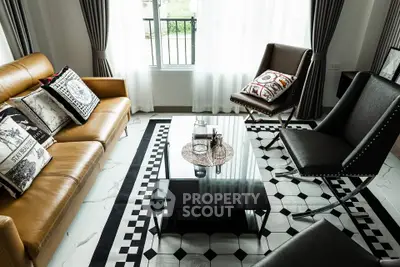 Stylish modern living room with elegant furniture and natural light.