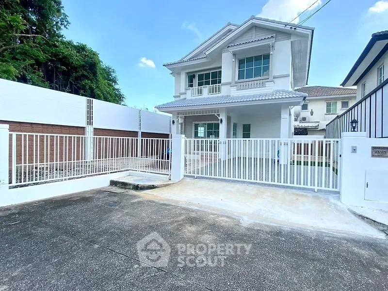 Stunning two-story house with modern design and spacious driveway in a serene neighborhood.