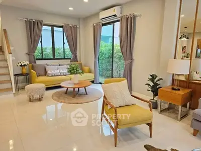 Spacious living room with modern decor and natural light