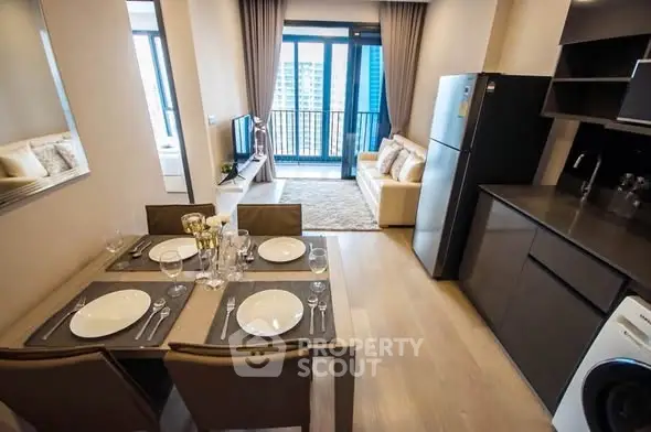 Modern open-plan living room and kitchen with stylish decor and city view balcony.