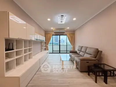 Spacious modern living room with city view and elegant furnishings.