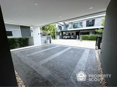 Spacious modern driveway with elegant paving in upscale residential area