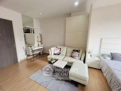 Modern studio apartment with cozy living area and stylish decor