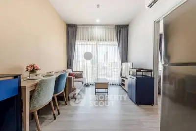 Modern living room with stylish furniture and large windows offering city views