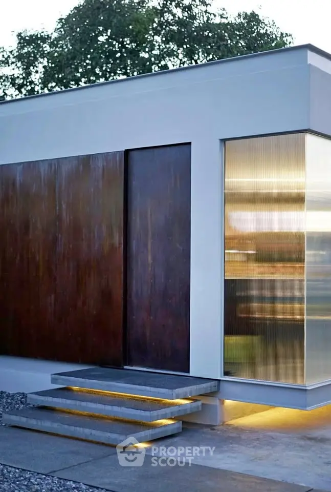 Modern minimalist exterior with sleek design and ambient lighting