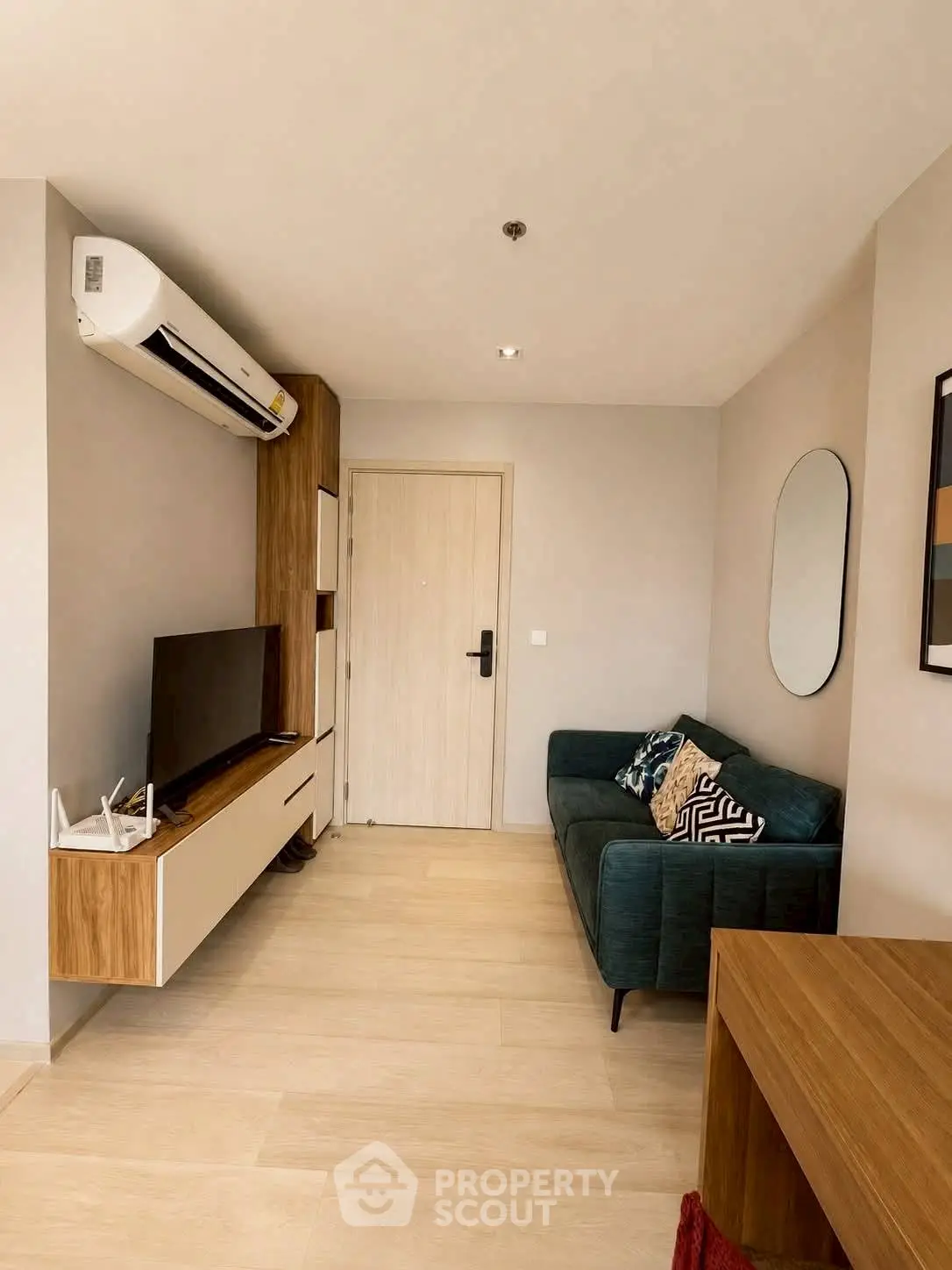 Modern living room with sleek furniture and air conditioning, perfect for comfortable urban living.