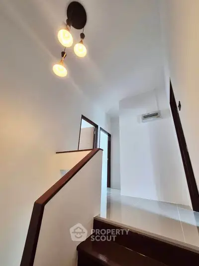 Modern staircase with elegant lighting in a minimalist home interior