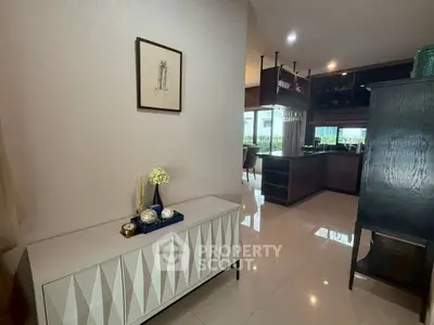 Modern open-layout kitchen with sleek cabinetry and elegant decor