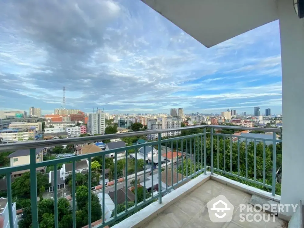 Expansive balcony offering breathtaking panoramic city views, perfect for outdoor relaxation and entertaining guests in an urban oasis.