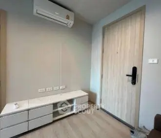 Modern minimalist room with air conditioning and sleek wooden door