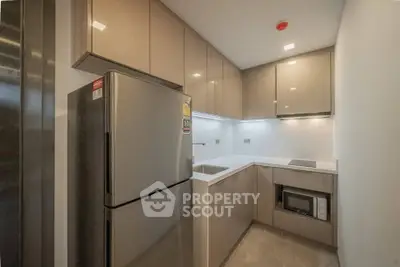 Modern kitchen with sleek cabinets and stainless steel appliances