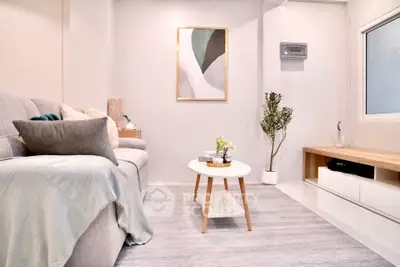 Stylish modern living room with cozy sofa and elegant decor