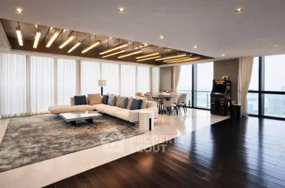 Luxurious modern living room with panoramic city views and stylish decor