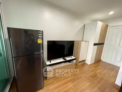 Modern living room with sleek appliances and stylish wooden flooring