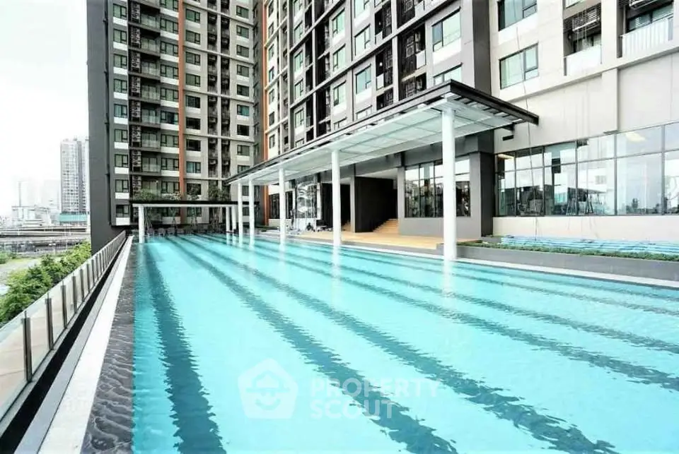 Luxurious condominium with stunning outdoor pool and modern architecture.