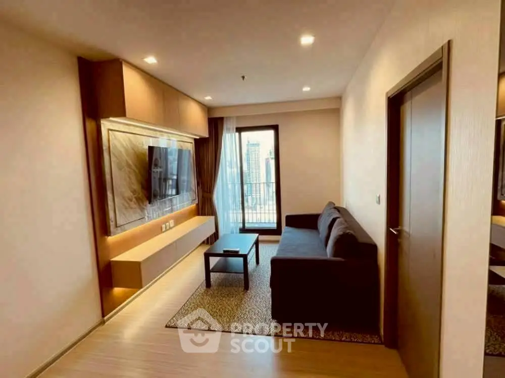 Modern living room with sleek furniture and city view balcony access.