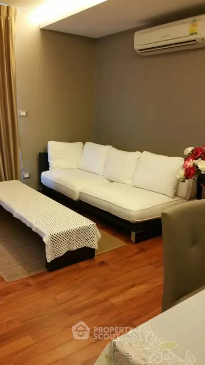 Cozy living room with modern sofa and air conditioning