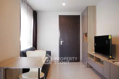 Modern living room with sleek furniture and natural light, perfect for cozy living.
