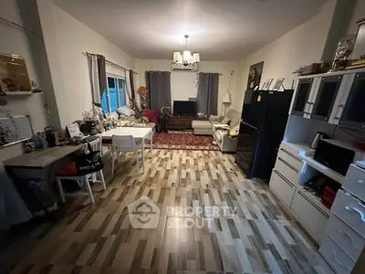 Spacious living room with modern decor and ample natural light