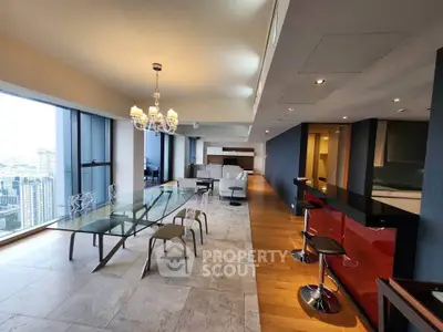 Luxurious open-plan living and dining area with stunning city views and modern furnishings.