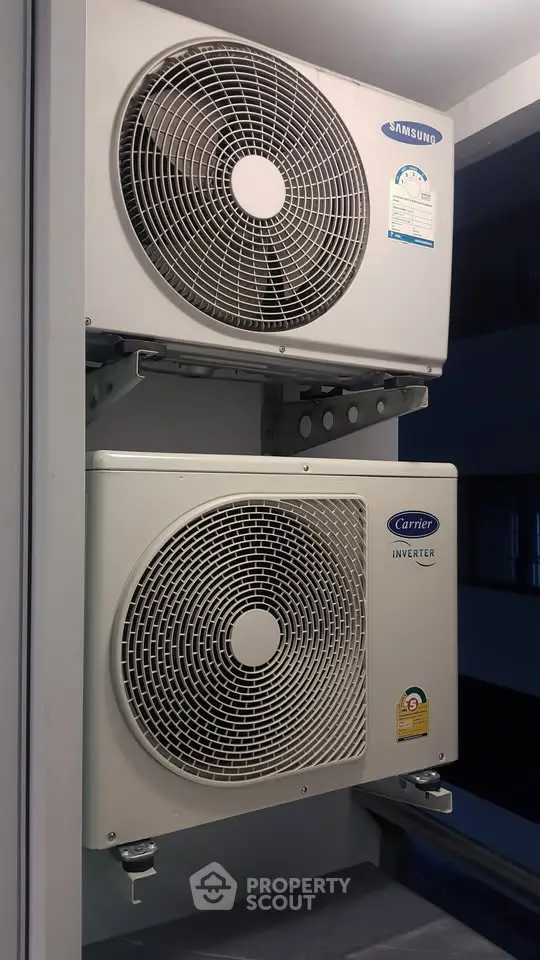Dual air conditioning units installed on a building exterior for efficient climate control.
