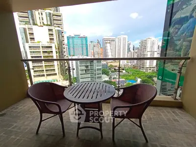 Charming balcony with city skyline view, perfect for relaxation and urban living.