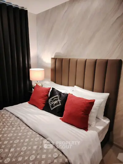 Luxurious bedroom with elegant headboard and stylish decor, perfect for modern living.