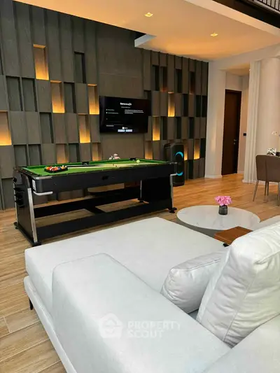 Luxurious living room with pool table and modern decor