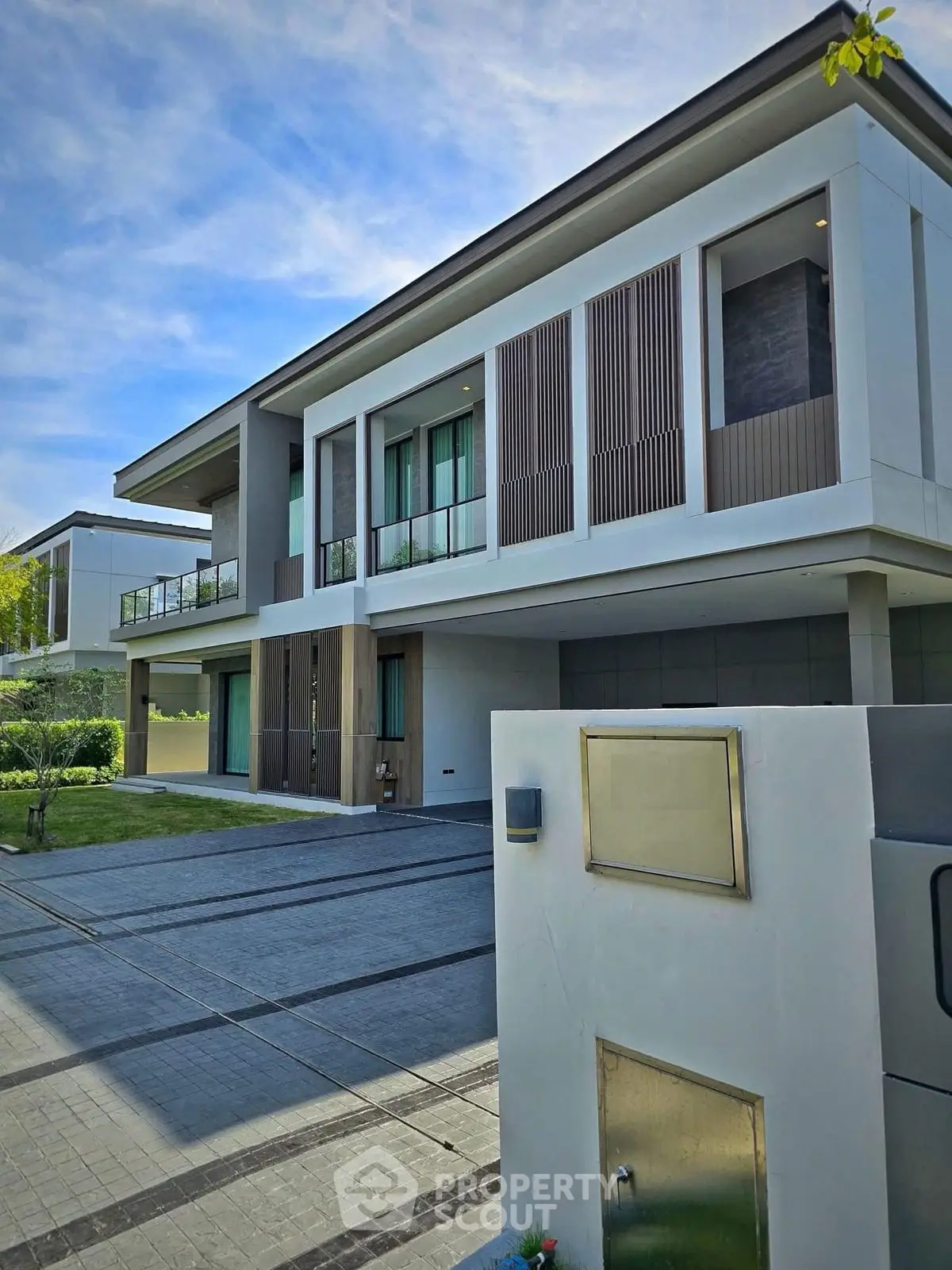 Modern luxury home exterior with sleek design and spacious driveway