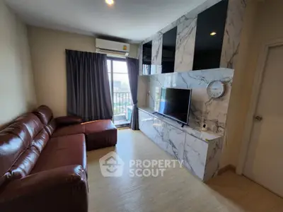 Modern living room with marble TV wall and leather sofa, featuring a city view from the window.