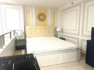 Luxurious bedroom with elegant decor and plush bed in modern apartment