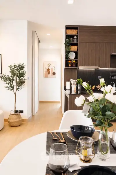 Modern open-plan kitchen and dining area with stylish decor and natural light.