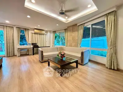 Spacious modern living room with elegant decor and large windows