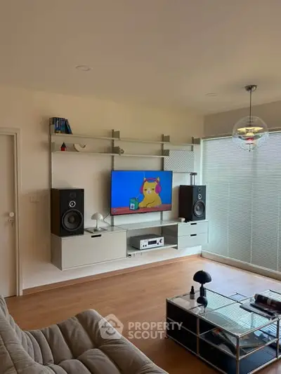 Modern living room with sleek entertainment setup and stylish decor