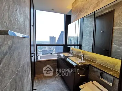 Luxurious bathroom with stunning city view and modern fixtures