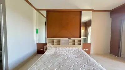 Spacious bedroom with modern design and built-in storage, perfect for comfortable living.