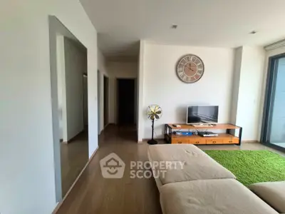 Modern living room with stylish decor and large window view