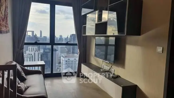 Modern living room with stunning city view and sleek entertainment unit.