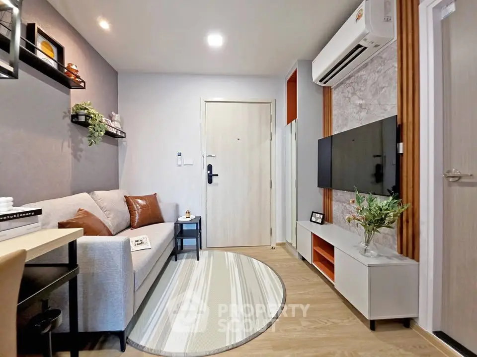 Modern living room with stylish decor and air conditioning in a cozy apartment.