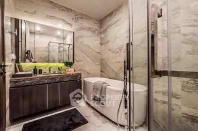 Luxurious modern bathroom with marble walls and freestanding bathtub