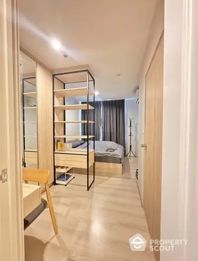 Modern bedroom with stylish shelving and natural light