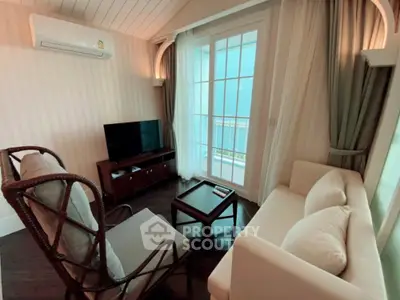 Cozy living room with elegant furniture and balcony view