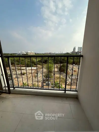 Spacious balcony with stunning city and nature views, perfect for relaxation.