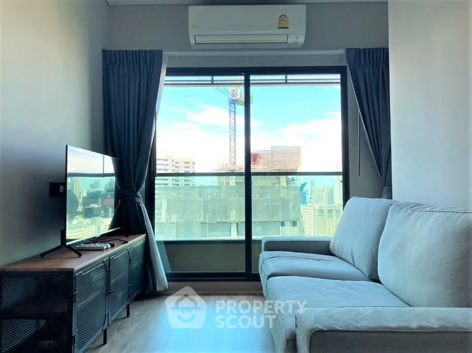 Modern living room with city view and cozy sofa in high-rise apartment