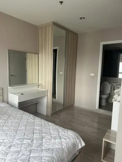 Modern bedroom with ensuite bathroom and stylish wardrobe