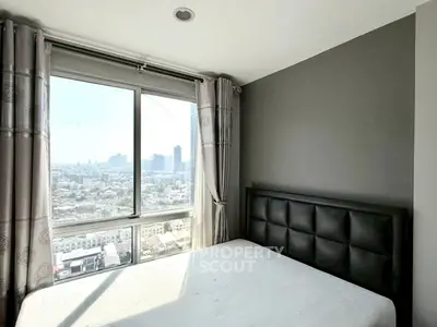 Modern bedroom with large window offering stunning city views, featuring a stylish bed and elegant curtains.