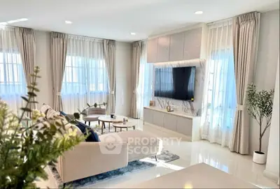 Luxurious modern living room with elegant decor and ambient lighting