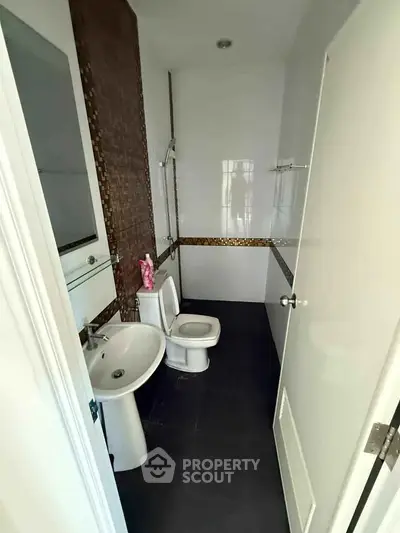 Modern bathroom with sleek fixtures and stylish tile accents