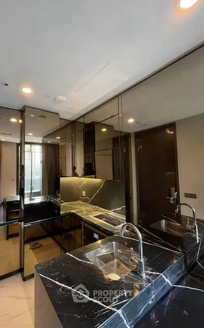 Luxurious modern bathroom with sleek black marble countertops and dual sinks