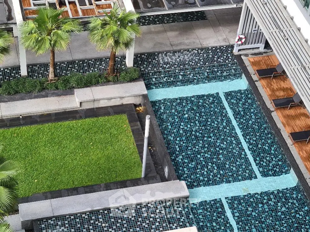 Luxurious rooftop pool with lush greenery and modern design, perfect for relaxation and leisure.